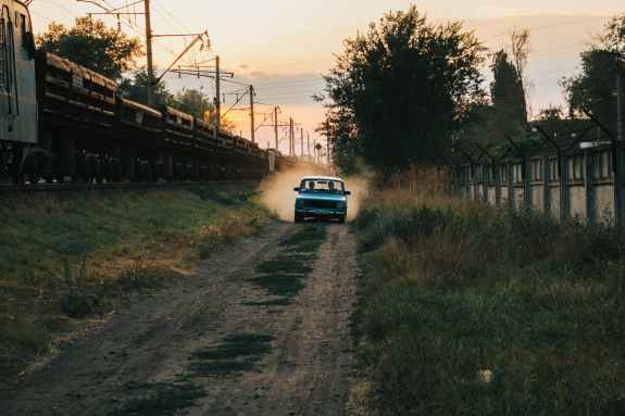 blue car on road